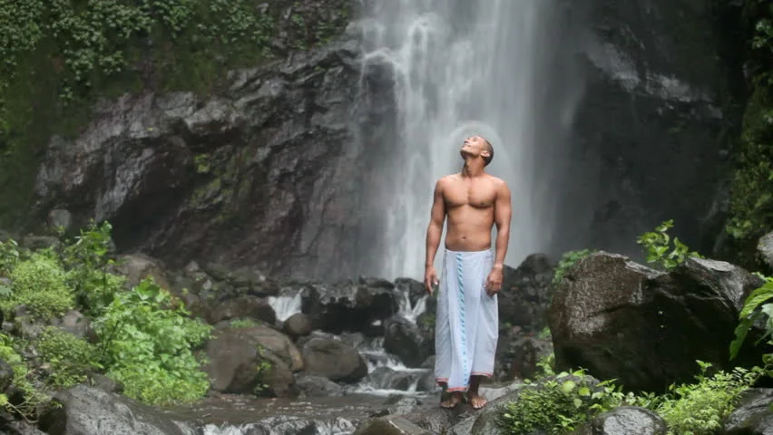 yogis under waterfall